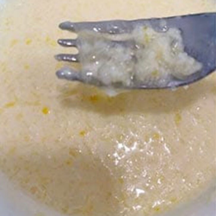 Stirring the wet ingredients together with a fork.