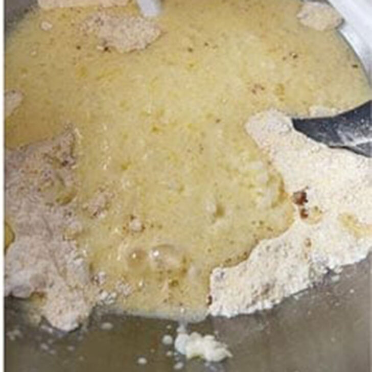 Mixing the batter together in the mixing bowl,