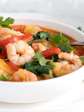 Thai red curry shrimp in white bowl