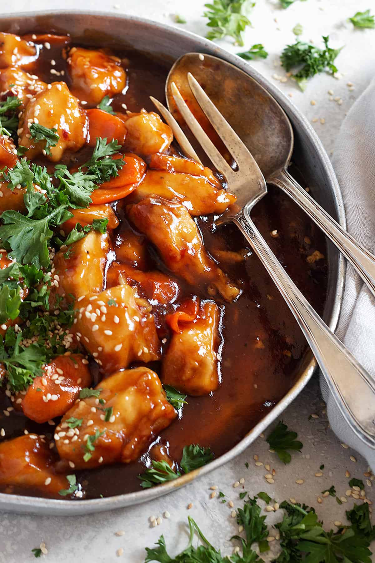 General Tso's chicken in pan with fork