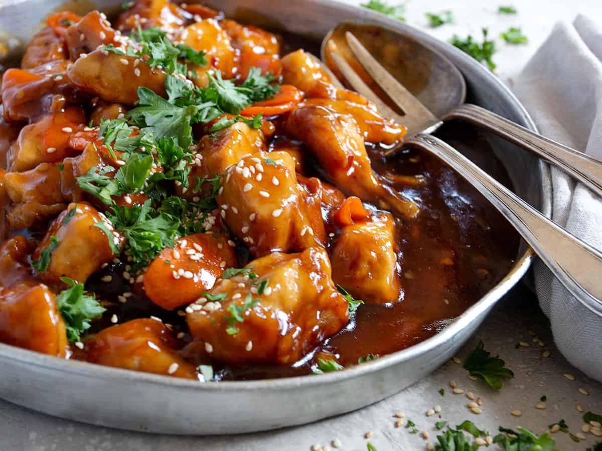 General Tso's chicken in pan with fork