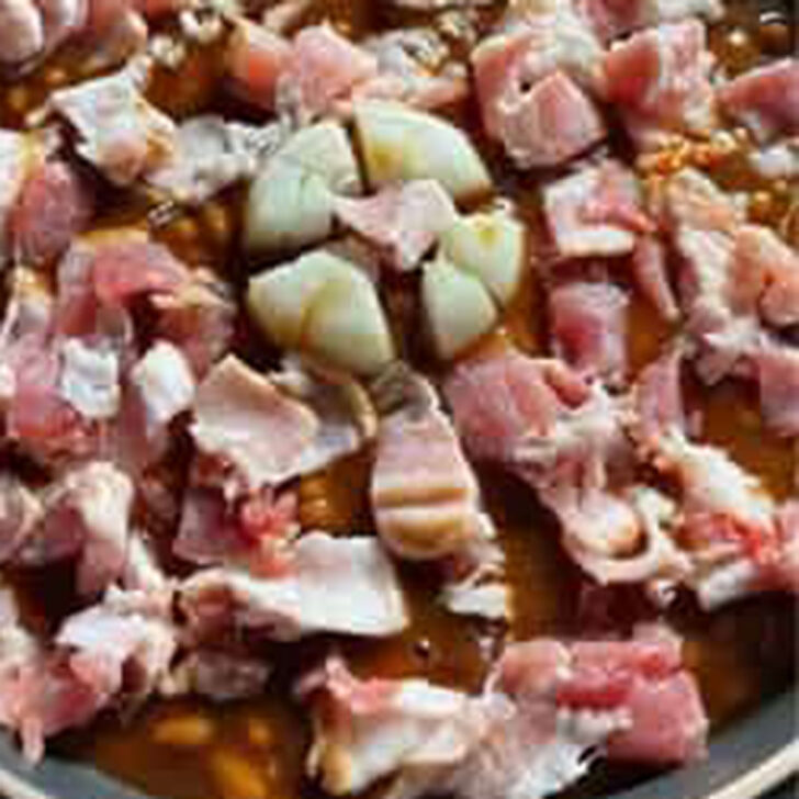 Bacon and onion added to the pork and beans mixture.