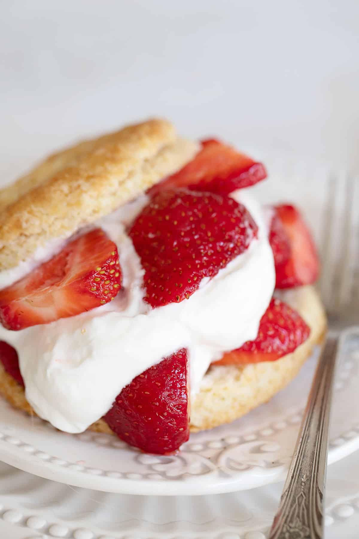 old-fashioned strawberry shortcake on plate with fork