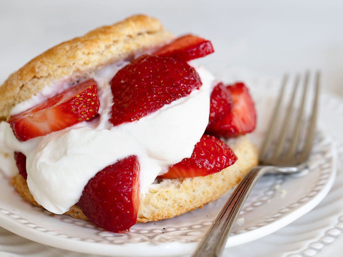 old-fashioned strawberry shortcake on plate with fork