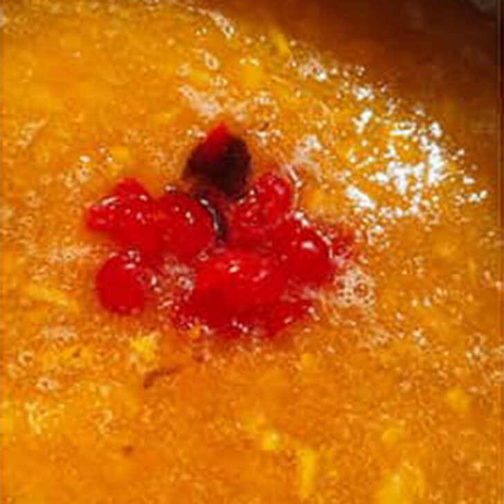 Maraschino cherries added to the marmalade.