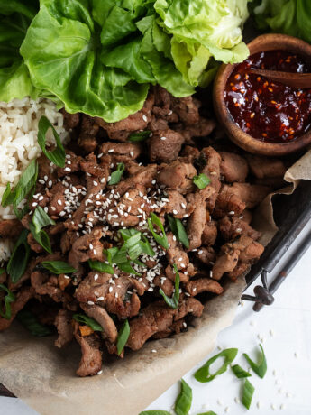 pork bulgogi on tray with rice and lettuce