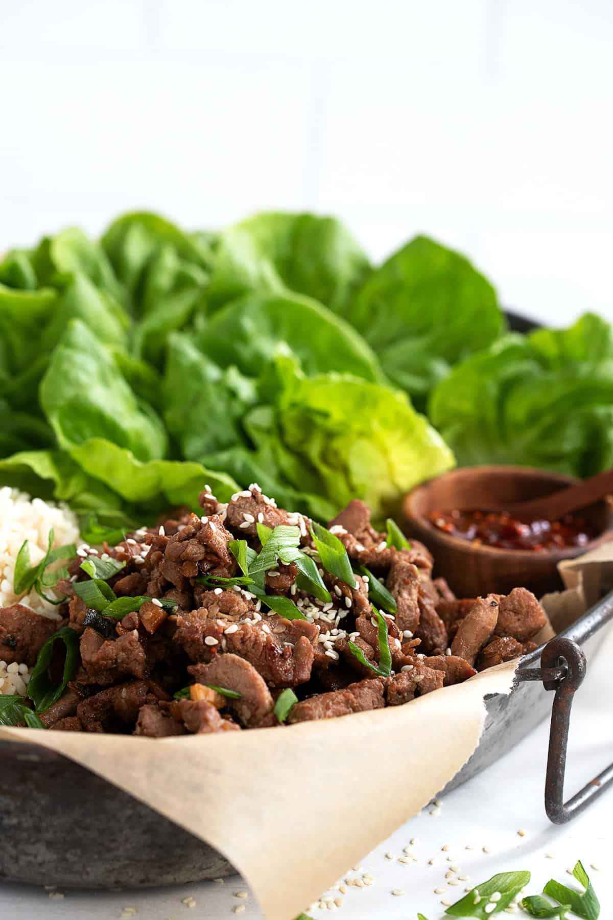 pork bulgogi on platter with rice and lettuce