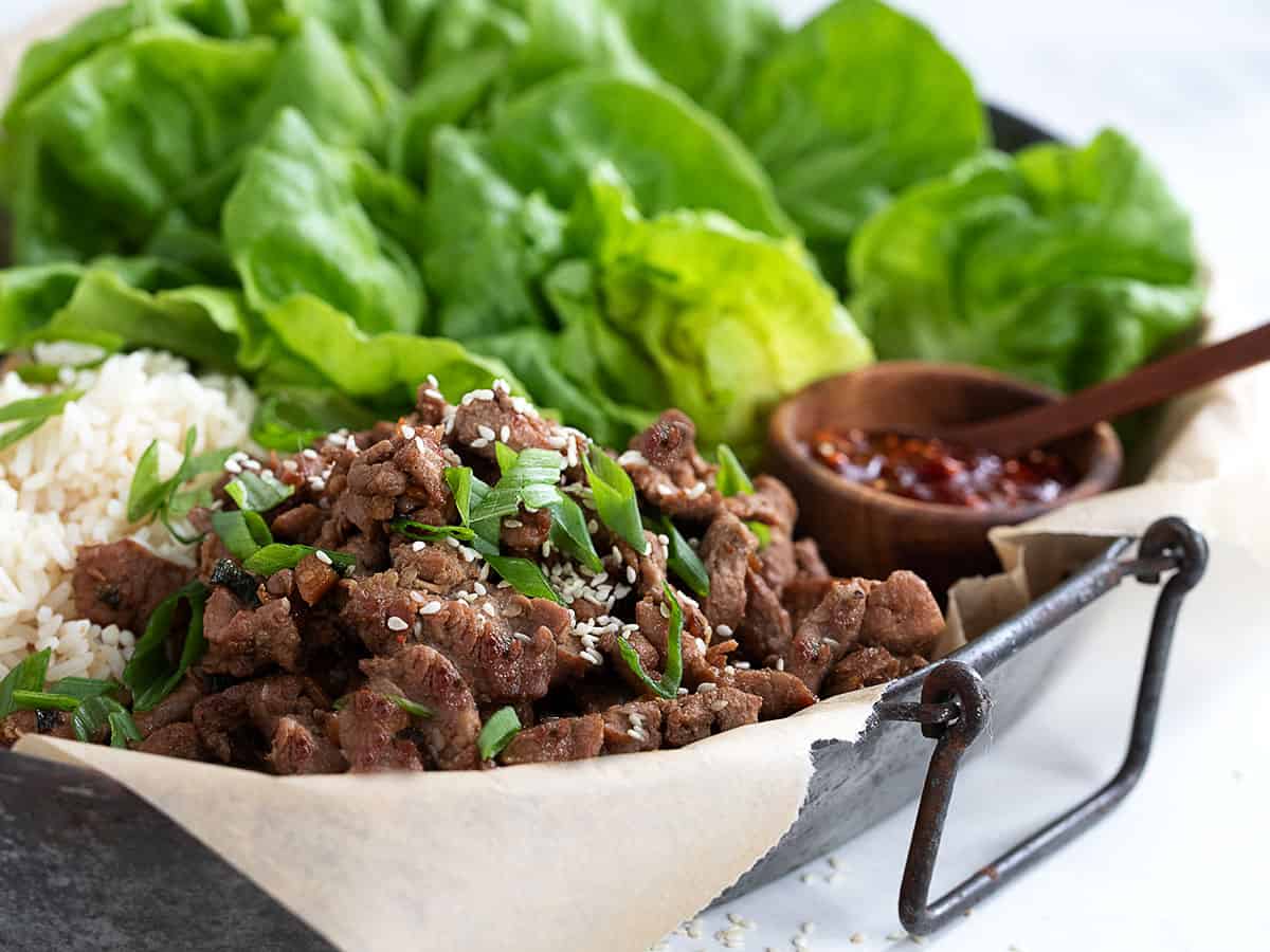 pork bulgogi on platter with rice and lettuce