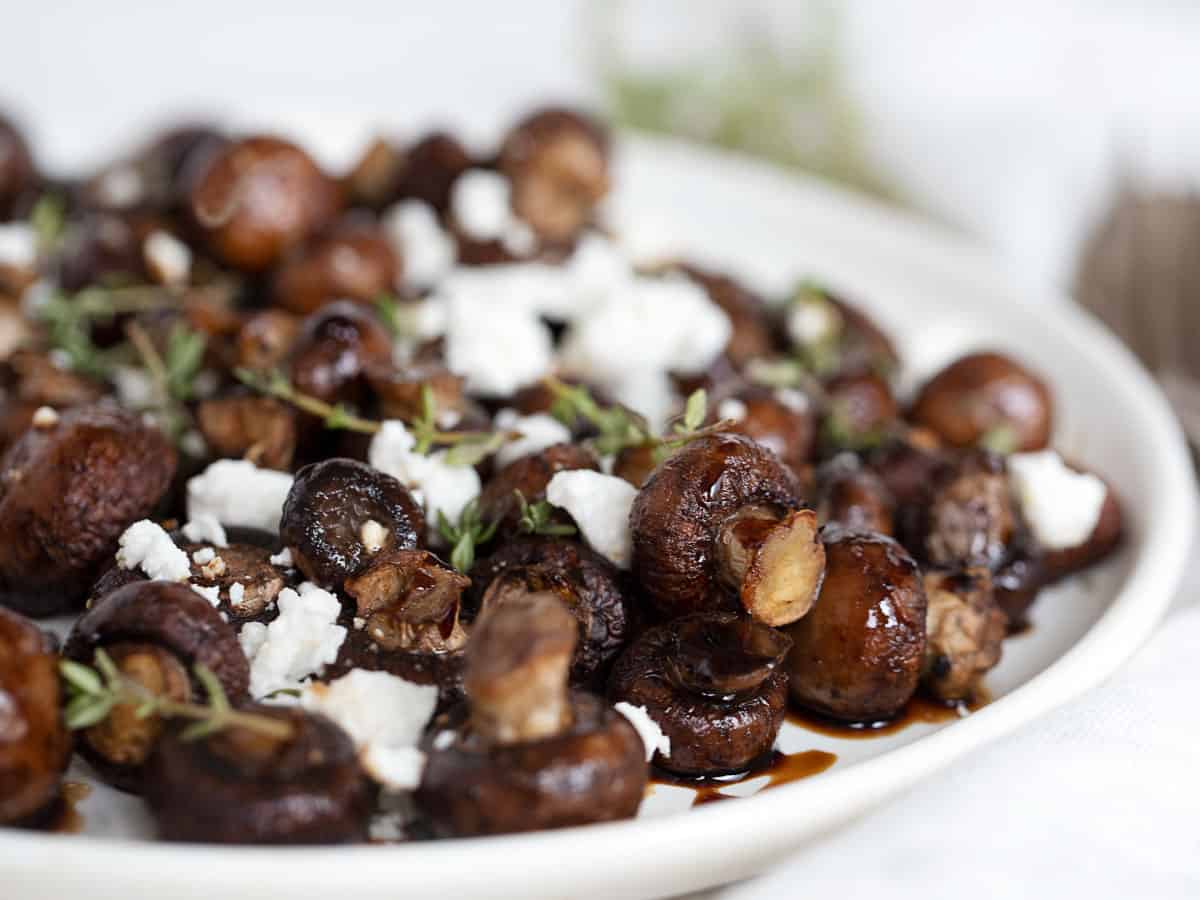 air fried mushrooms in bowl with balsamic and goat cheese