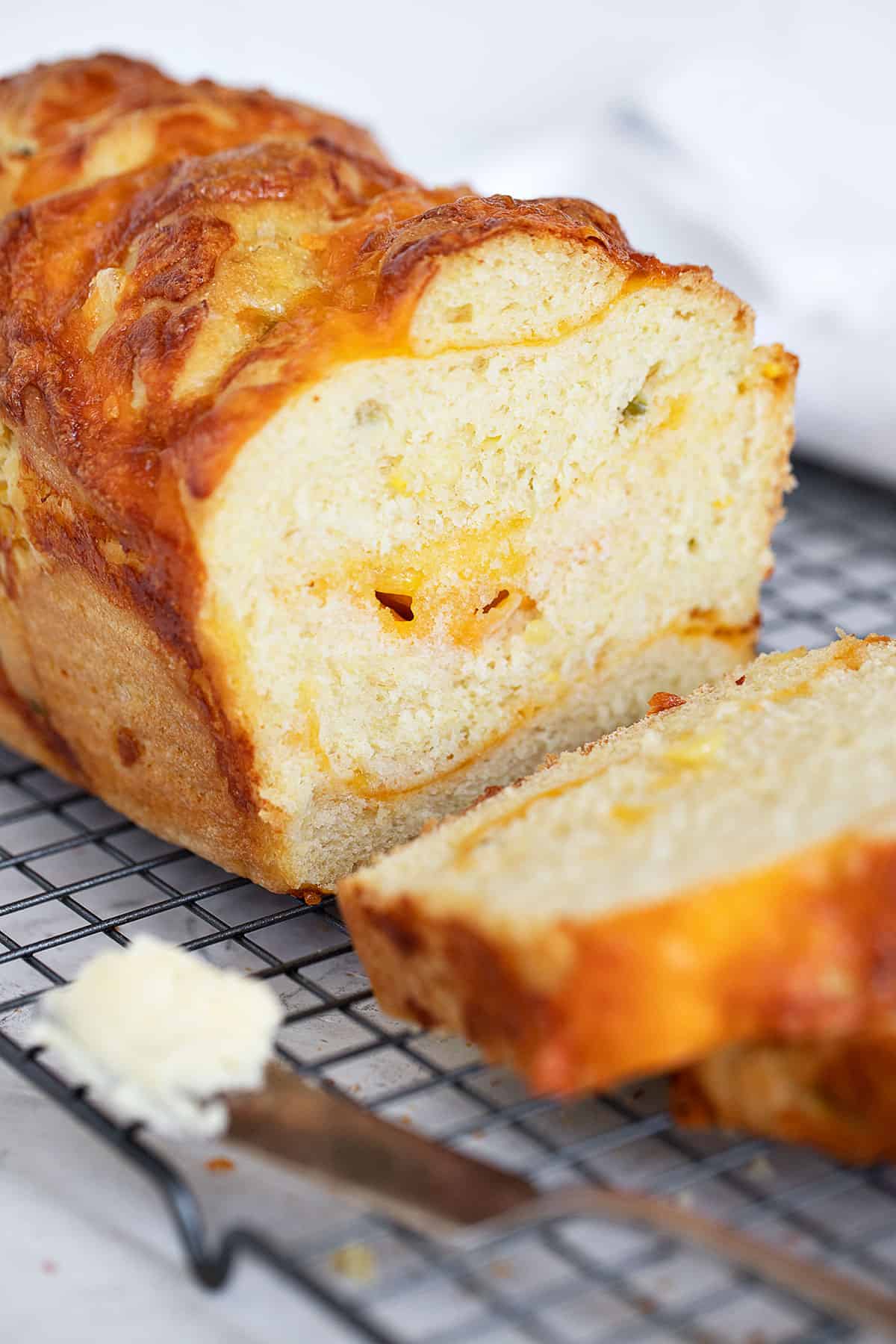 jalapeno corn cheese bread sliced on cooling rack