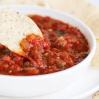 salsa in white bowl with tortilla chips