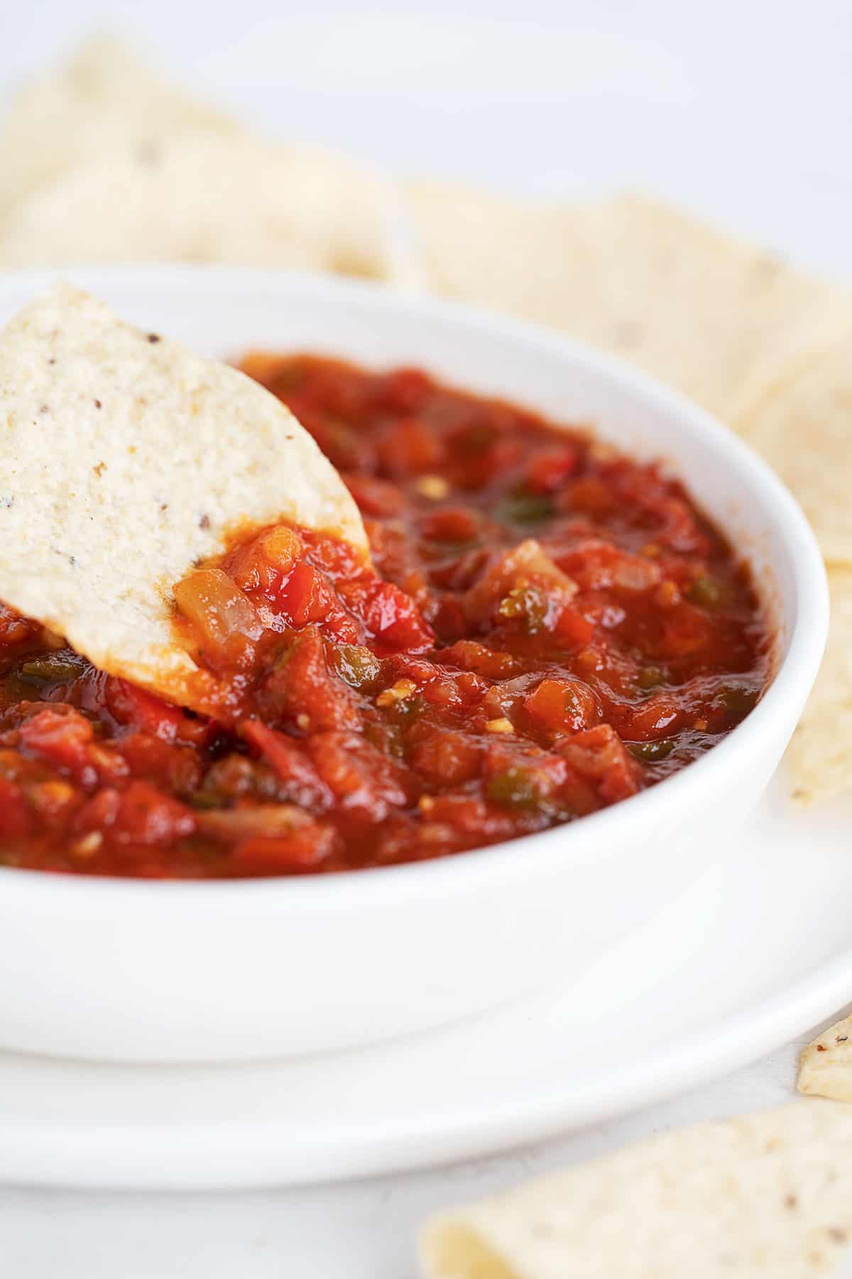 salsa in white bowl with tortilla chips