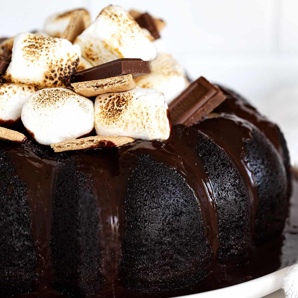 s'mores bundt cake topped with marshmallows