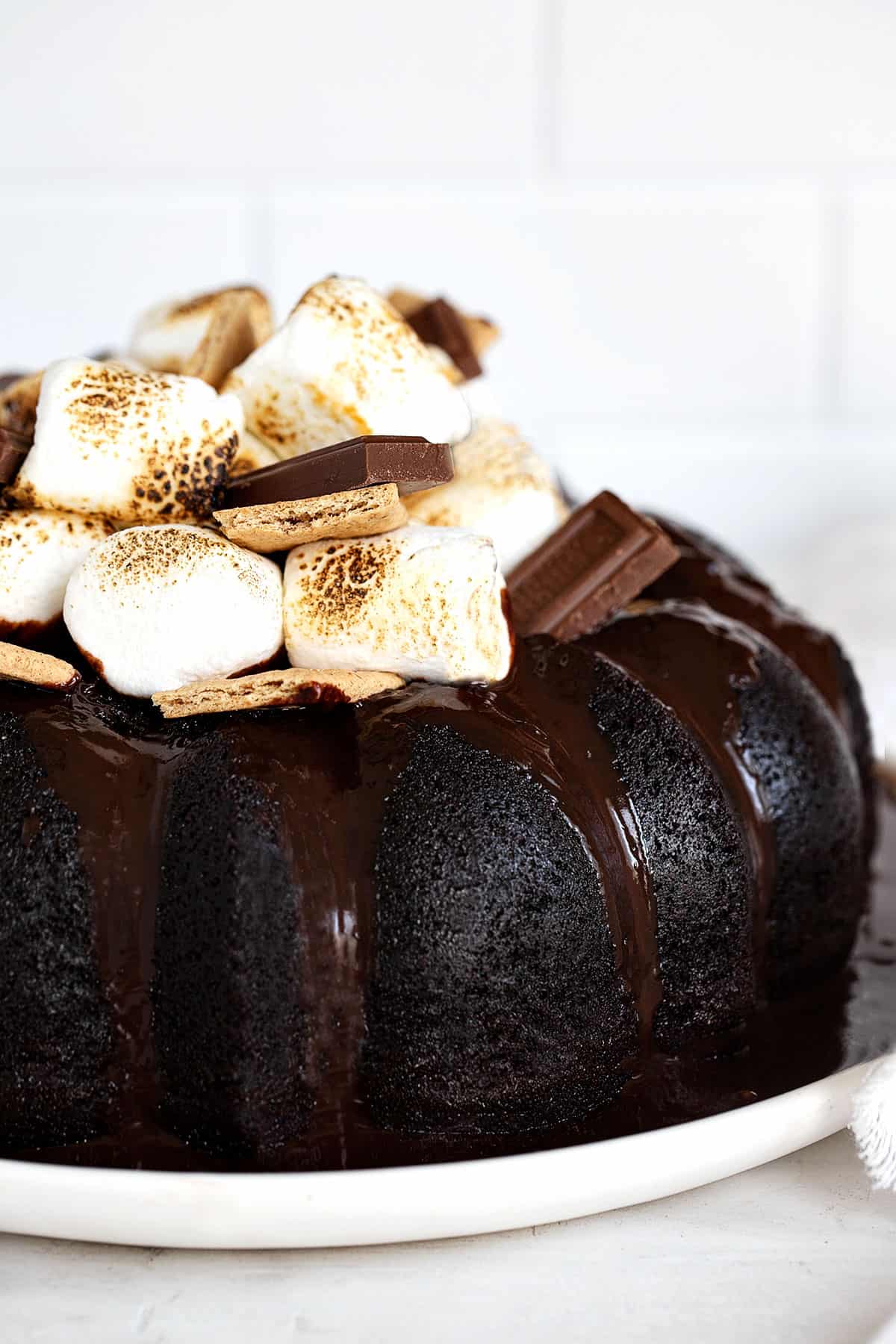 s'mores bundt cake topped with marshmallows