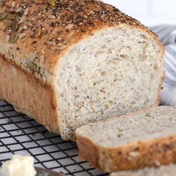 seeded multigrain bread sliced on cooling rack