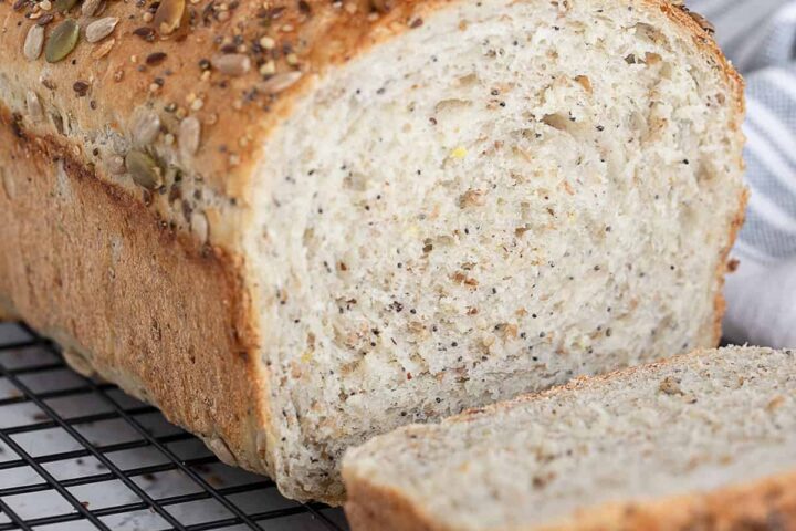 seeded multigrain bread sliced on cooling rack