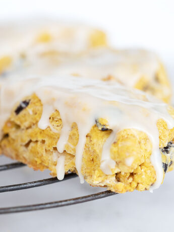 Maple glazed pumpkin scones on cooling rack.