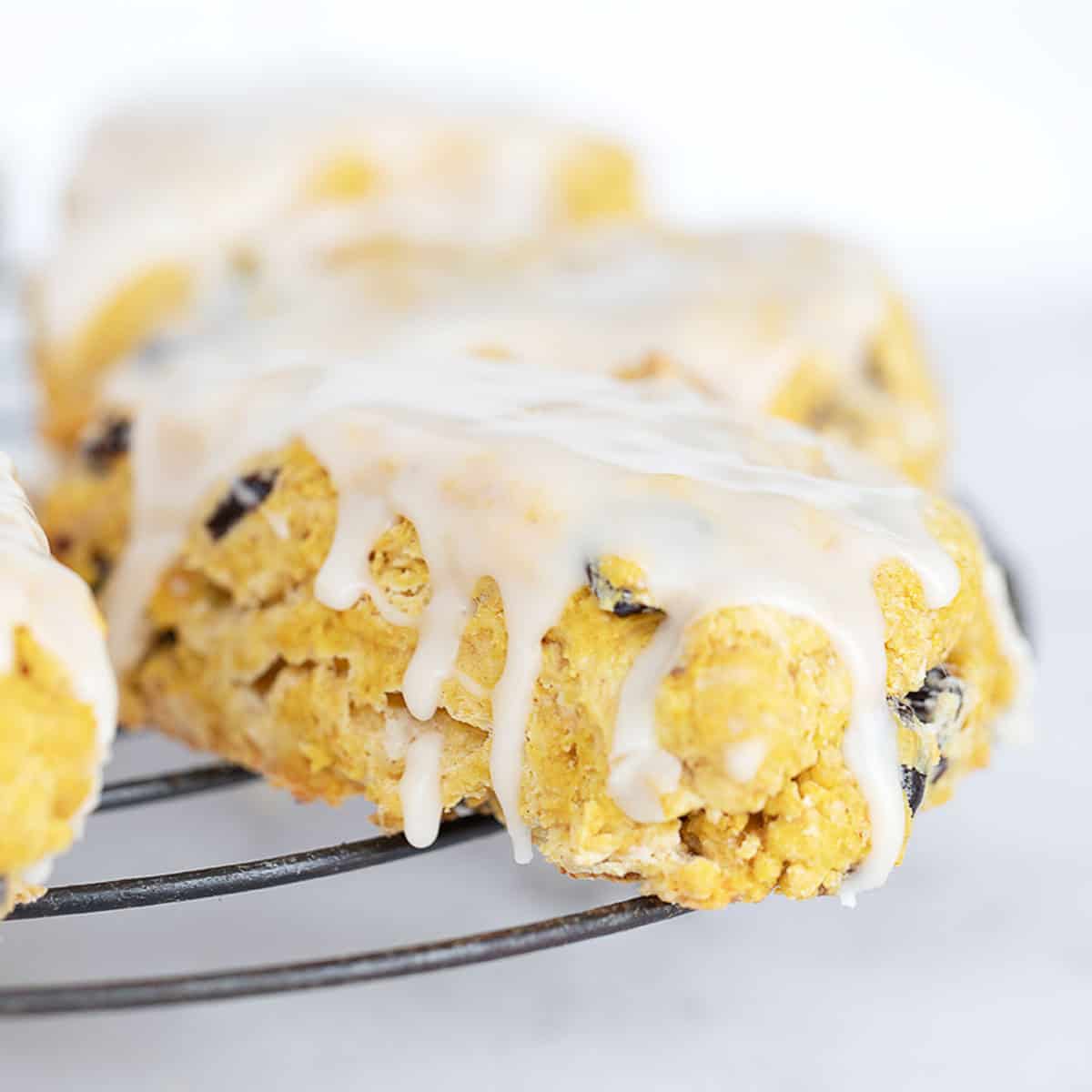 Maple glazed pumpkin scones on cooling rack.