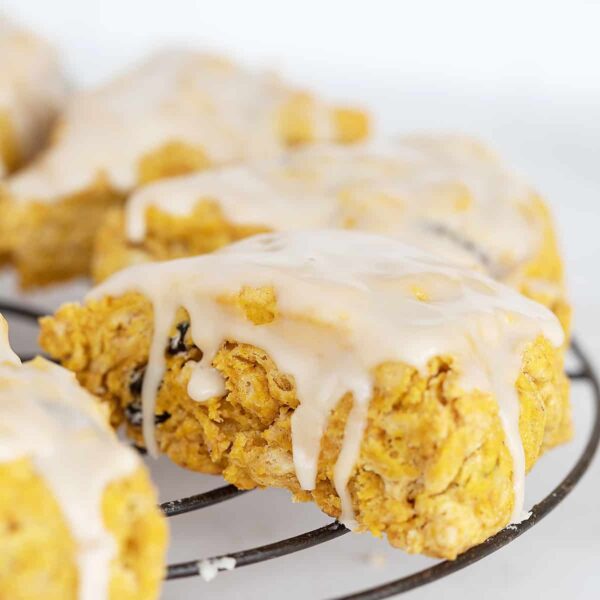 pumpkin scones with maple glaze on cooling rack