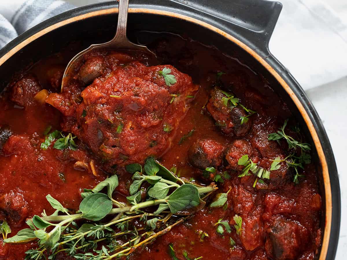chicken cacciatore in pan with spoon