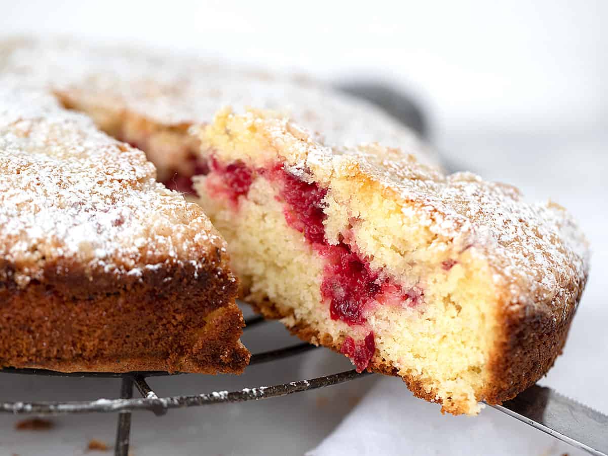 cranberry coffee cake, sliced on cooling rack