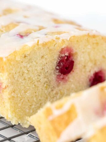 cranberry lemon loaf sliced on cooling rack