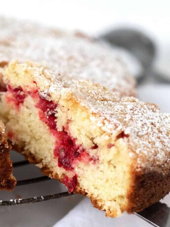 cranberry coffee cake, sliced on cooling rack