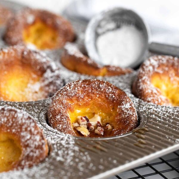 mini pumpkin Dutch baby pancakes in muffin tin