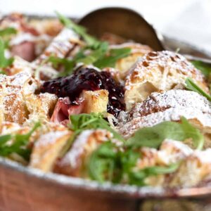 savoury ham and cheese bread pudding in baking dish