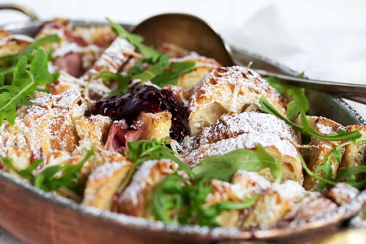 savoury ham and cheese bread pudding in baking dish