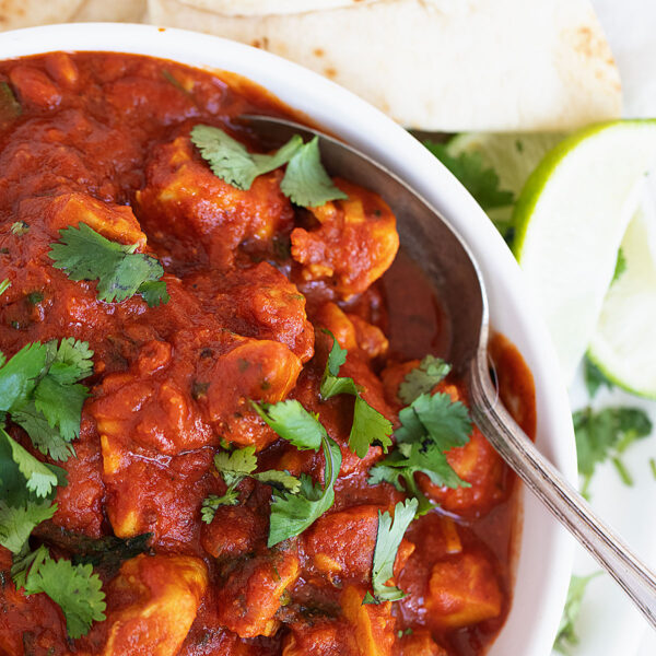 chicken madras in bowl with spoon