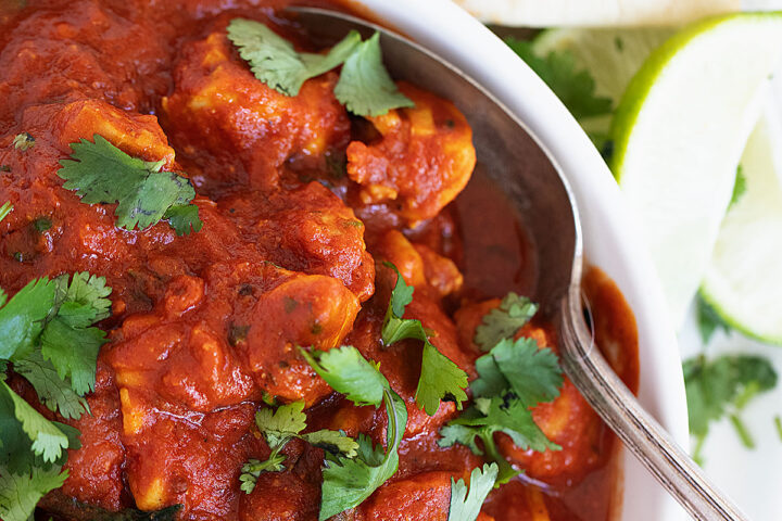 chicken madras in bowl with spoon