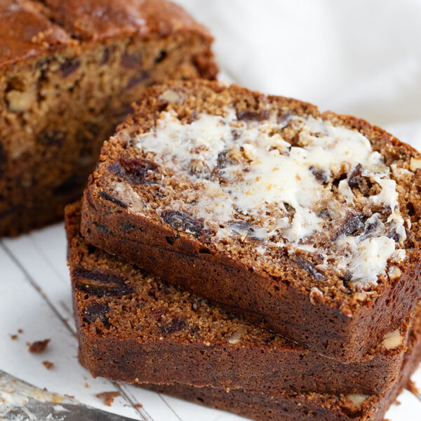 Date nut bread sliced and buttered.