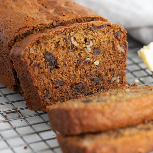 date nut bread sliced on wire cooling rack