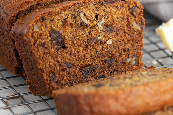 date nut bread sliced on wire cooling rack