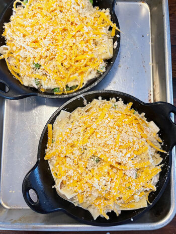 tuna casserole in skillets with topping ready to bake