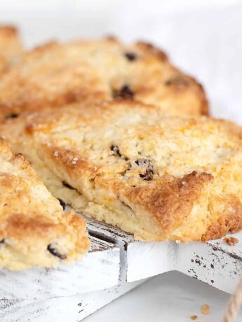 cranberry orange scones on wooden tray