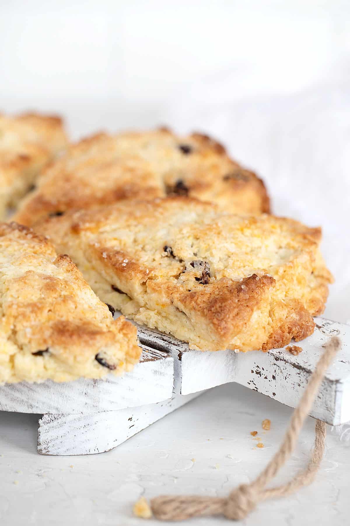 cranberry orange scones on wooden tray