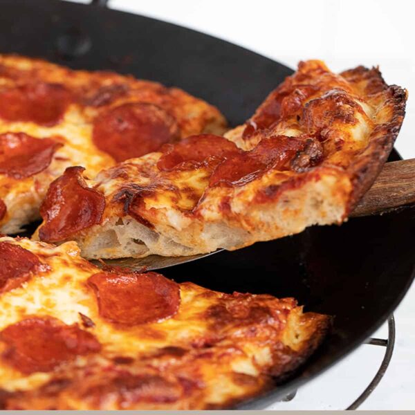 pan pizza sliced in pan