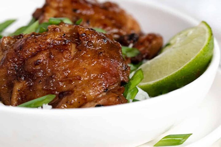 chicken adobo in bowl with rice