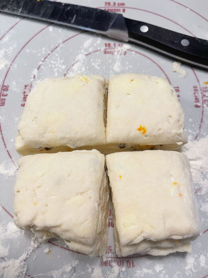 Cutting the scone dough into 4 squares.