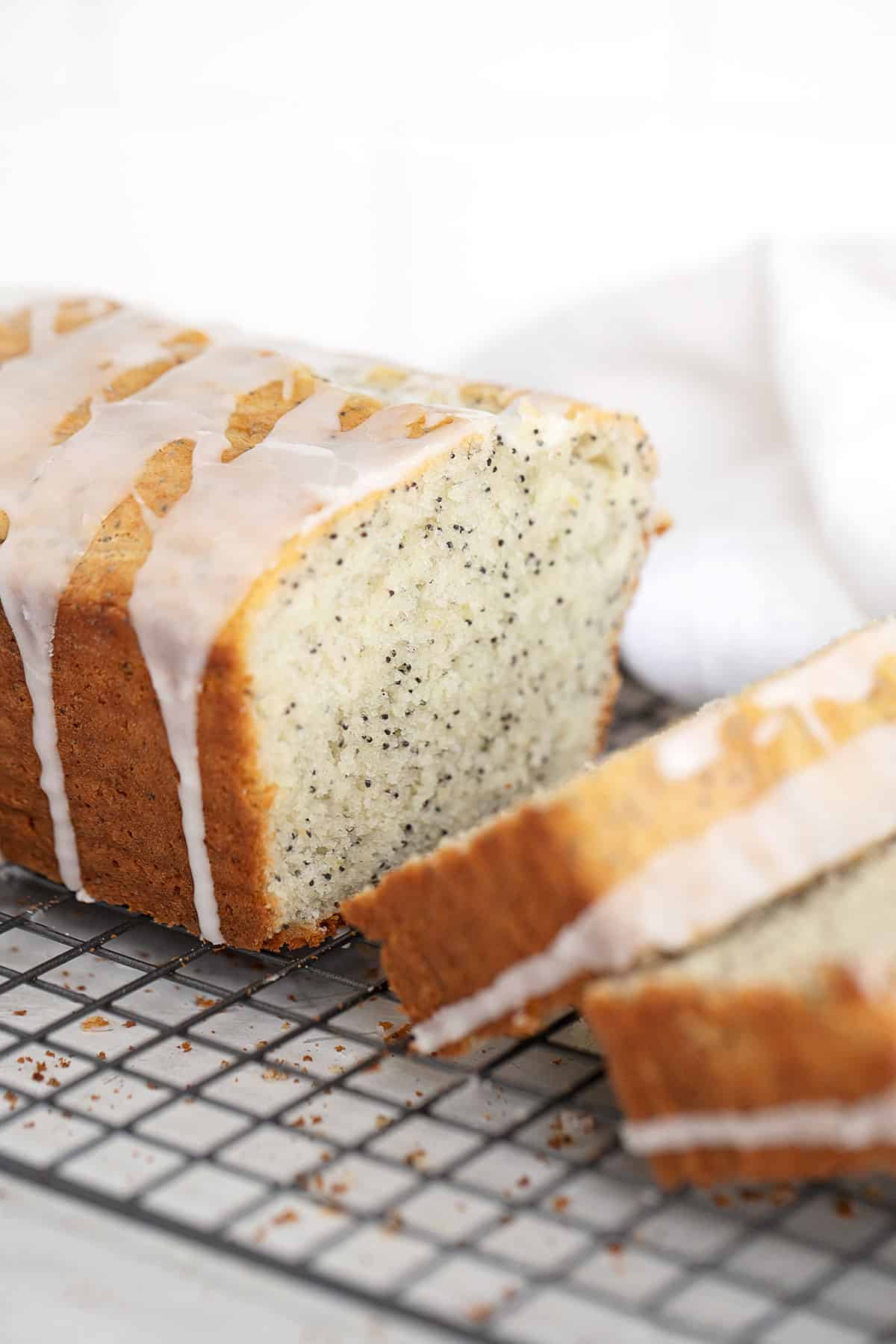 lemon poppy seed loaf, sliced on cooling rack