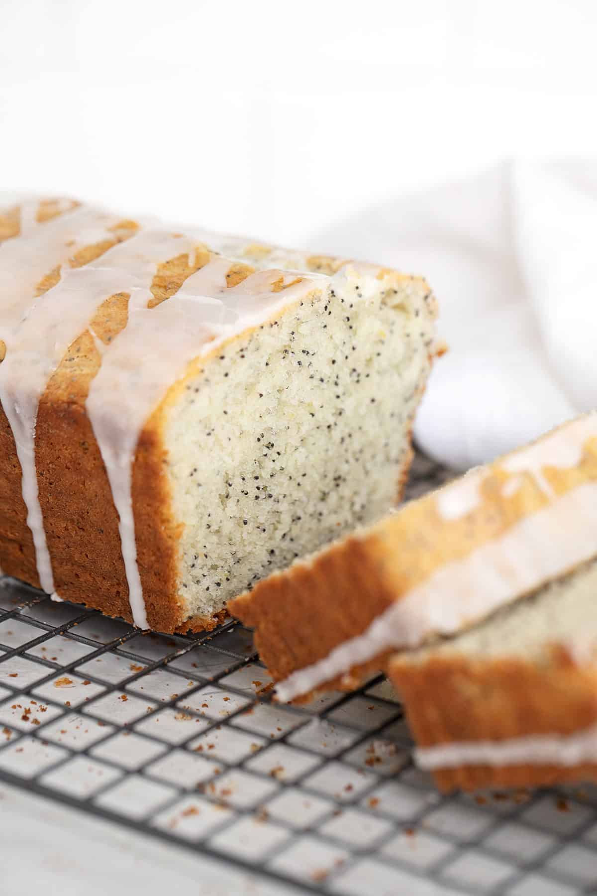 lemon poppy seed loaf, sliced on cooling rack