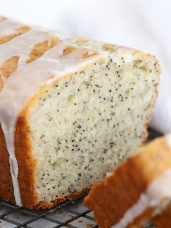 lemon poppy seed loaf sliced on cooling rack