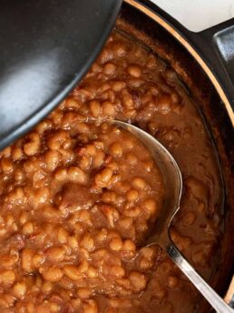 maple baked beans in pot with spoon