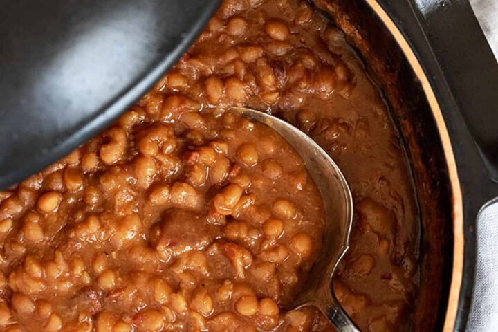 maple baked beans in pot with spoon