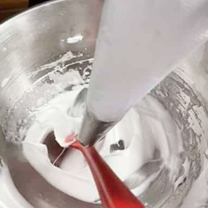 Meringue added to a piping bag.