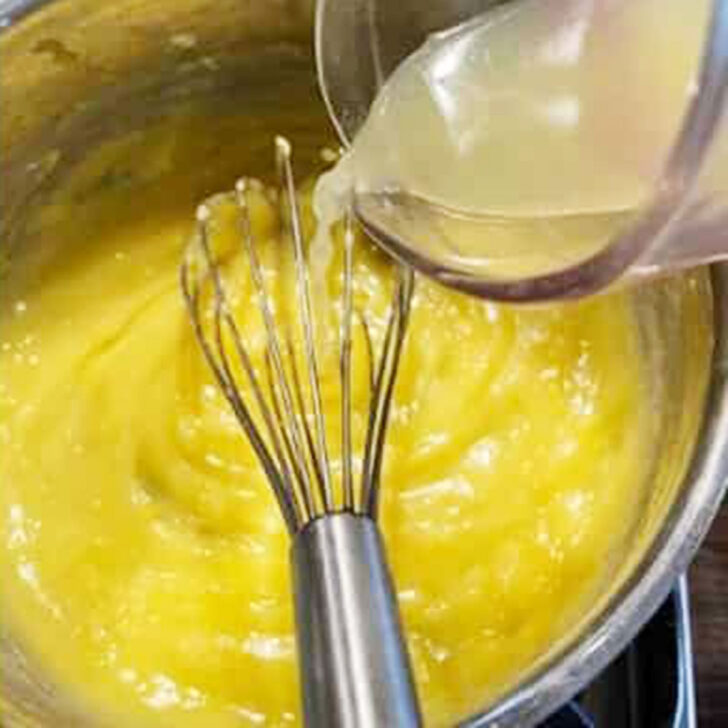 Adding the lemon juice to the pudding.