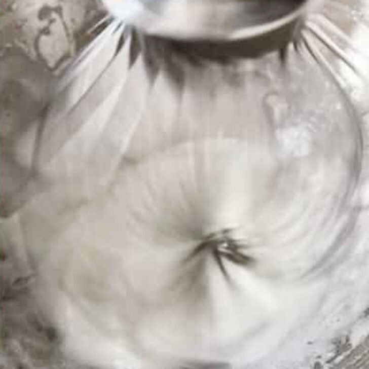 Whipping the meringue in a stand mixer.