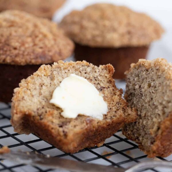 banana crumb muffin sliced with butter